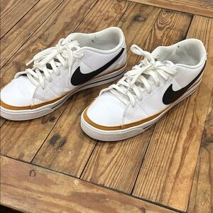 Nike White and Black Sneakers with Gold Accents